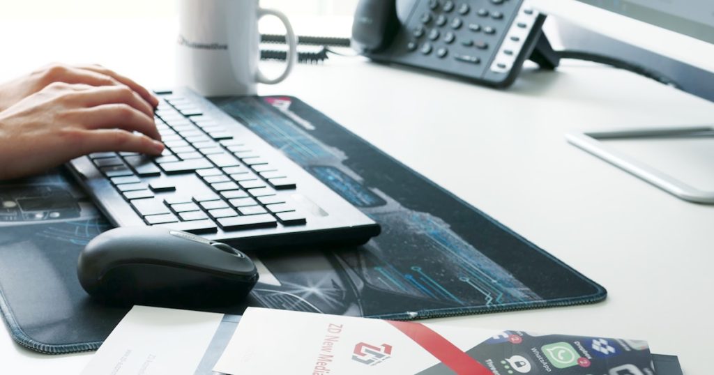 white and gray computer keyboard on white table
