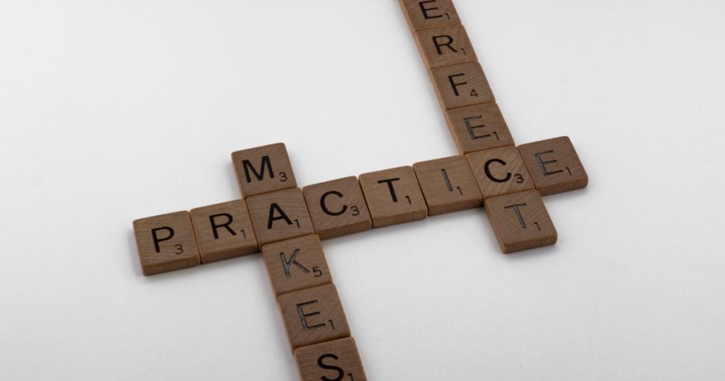 brown wooden cross on white surface